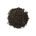 Cup of Milky Black tea from Lake Missoula Tea Company in a clear glass mug with a rich, dark brew and a hint of cream.