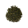 High Mountain Oolong tea leaves from Lake Missoula Tea Company, brewed in a clear glass teapot showcasing the tea's amber color.