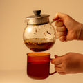 Lake Missoula Tea Company Pachamama Chai tea in a glass mug with cinnamon sticks and spices, ready to enjoy a warm, flavorful beverage.