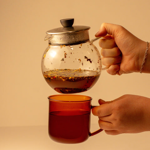 Lake Missoula Tea Company Pachamama Chai tea in a glass mug with cinnamon sticks and spices, ready to enjoy a warm, flavorful beverage.
