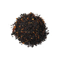 A cup of Ginger Peach Sunshine Daydream tea from Lake Missoula Tea Company, showcasing a steaming mug with tea and fresh ginger and peach slices.