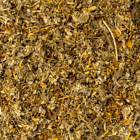 Texture shot of Lake Missoula Tea Company's Cycle Goddess herbal tea in a cup, showcasing the vibrant tea leaves and rich color.