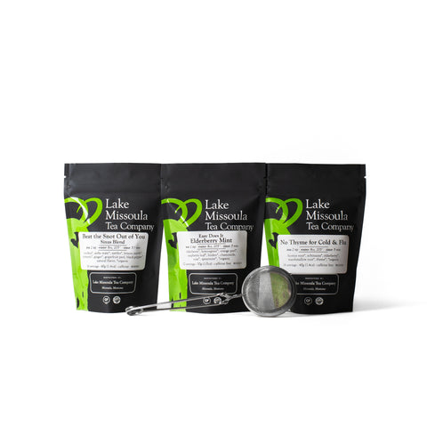 Lake Missoula Tea Company Medicine Chest Tea Bundle featuring assorted herbal tea tins in a decorative box.