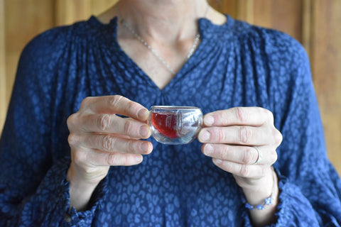 Glass cup of brewed tea from Lake Missoula Tea Company, showcasing a warm, inviting tea beverage in a clear glass.