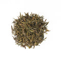 Golden yellow Huo Mountain Yellow Tea leaves from Lake Missoula Tea Company, displayed in a traditional tea bowl.