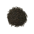 Kenyan black tea from Lake Missoula Tea Company, Nandi Hills Kenyan Black, brewed in a cup with rich dark leaves visible.