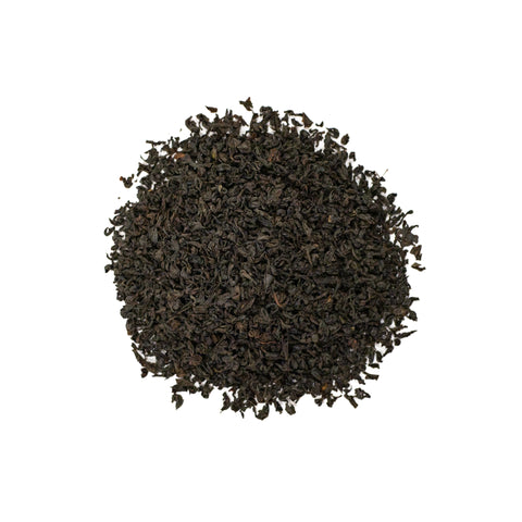 Kenyan black tea from Lake Missoula Tea Company, Nandi Hills Kenyan Black, brewed in a cup with rich dark leaves visible.