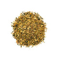Lake Missoula Tea Company's "Beat the Snot Out of You" sinus tea in a clear tea bag with dried herbs and lemon slices.