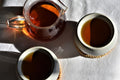 Cup of French Vanilla Almond tea from Lake Missoula Tea Company in a glass carafe, showcasing a warm, inviting tea beverage.