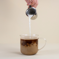 Mushies’ Instant Cup tea by Lake Missoula Tea Company shown in a cup with tea leaves and packaging in the background.