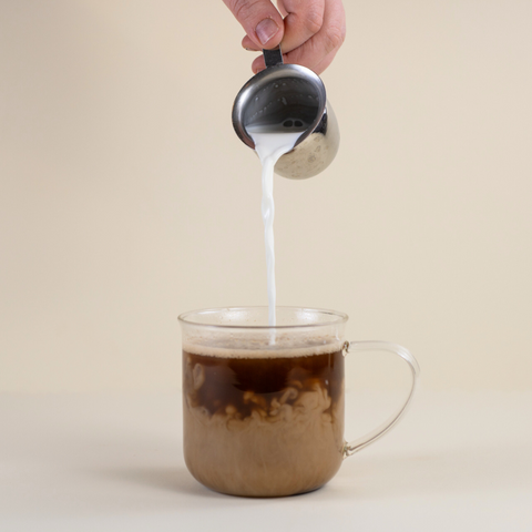 Mushies’ Instant Cup tea by Lake Missoula Tea Company shown in a cup with tea leaves and packaging in the background.