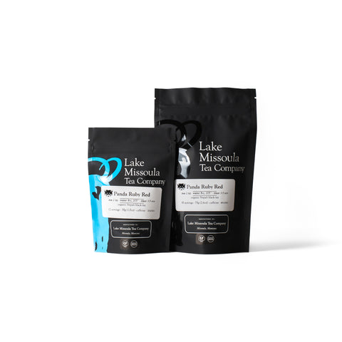 Animal Conservation Tea Bundle from Lake Missoula Tea Company featuring panda and ruby red tea blends in colorful packaging.