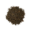 Loose Puerh Earl Grey tea leaves from Lake Missoula Tea Company in a clear glass jar.