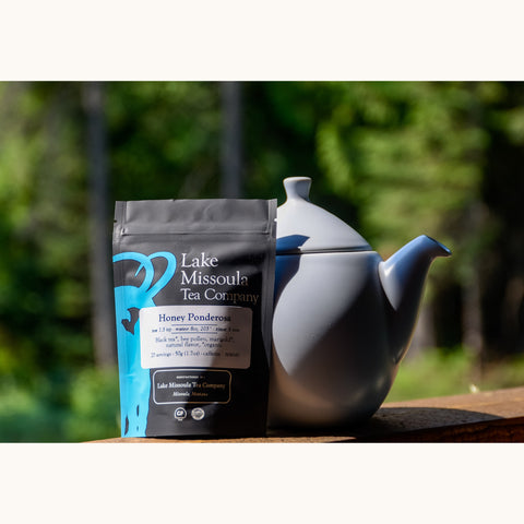 Loose leaf Honey Ponderosa tea from Lake Missoula Tea Company, showcasing golden honey-colored tea leaves in a clear bag.