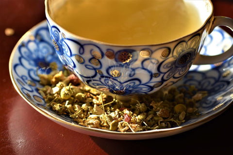 Close-up of a cup of Chamomile Calm tea by Lake Missoula Tea Company, showcasing the herbal tea with chamomile flowers.