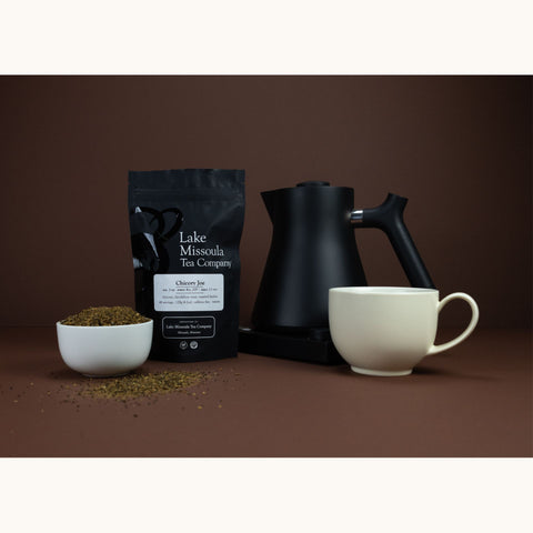 Chicory Joe tea in a white Fellow mug, brewed black with corvo-style presentation, from Lake Missoula Tea Company.