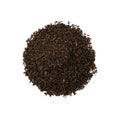 Dry Keemun black tea leaves from Lake Missoula Tea Company, showcasing the rich, dark tea leaves in a natural setting.