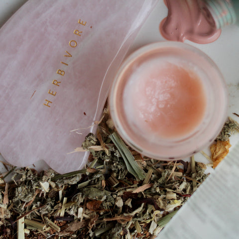 Fresh brewed Skin Glow tea from Lake Missoula Tea Company, featuring a clear glass cup with vibrant herbal tea leaves.