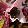 Assorted Puerh tea sampler by Lake Missoula Tea Company with eight different tea packages arranged on a wooden surface.