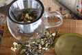 Loose leaf Cinnamon Chaga tea from Lake Missoula Tea Company, brewing in a glass teapot with a cloudy infusion.