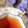 Fresh apricot-flavored Puerh tea leaves from Lake Missoula Tea Company in a clear glass jar.