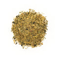 A cup of No Thyme for Cold & Flu herbal tea from Lake Missoula Tea Company with fresh thyme and herbs in a cozy setting.