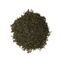 Loose Chunmee green tea leaves from Lake Missoula Tea Company, showing fresh, rolled green tea leaves in a natural setting