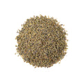 A cup of Lavender Lift tea from Lake Missoula Tea Company with fresh lavender flowers and tea leaves in a cozy setting.