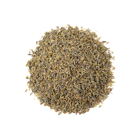 A cup of Lavender Lift tea from Lake Missoula Tea Company with fresh lavender flowers and tea leaves in a cozy setting.