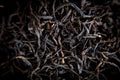 Black wiry English Breakfast tea leaves from Lake Missoula Tea Company, showcasing the dry, twisted black tea leaves.