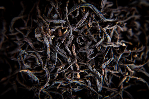 Black wiry English Breakfast tea leaves from Lake Missoula Tea Company, showcasing the dry, twisted black tea leaves.