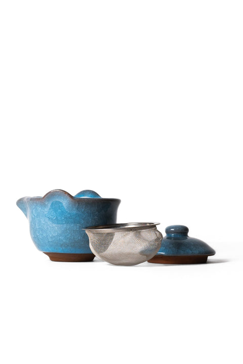 Blue Gaiwan teaware with strainer and lid from Lake Missoula Tea Company, used for Gong Fu Cha brewing.