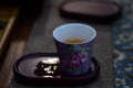 Close-up of a cup of GABA Oolong tea by Lake Missoula Tea Company, showcasing the brewed tea's rich amber color.