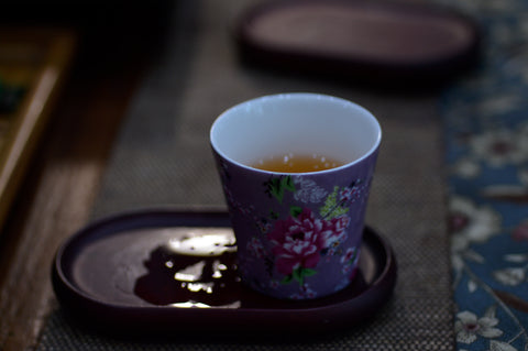 Close-up of a cup of GABA Oolong tea by Lake Missoula Tea Company, showcasing the brewed tea's rich amber color.