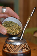 Yerba Maté tea leaves in a bowl from Lake Missoula Tea Company, ready for brewing, showcasing fresh, dried yerba mate.