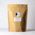 Apricot Green tea by Lake Missoula Tea Company in a 500g package, showcasing fresh green tea leaves with apricot aroma.