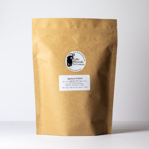Apricot Green tea by Lake Missoula Tea Company in a 500g package, showcasing fresh green tea leaves with apricot aroma.