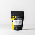Dried GABA Oolong tea leaves from Lake Missoula Tea Company in a 20g package, showcasing the rolled, dark tea leaves.