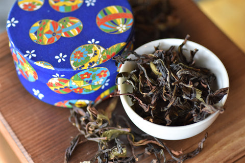 Close-up of Lake Missoula Tea Company's GABA Oolong tea leaves in a tin container, showcasing the premium tea packaging.