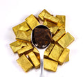 Golden Brick Puerh tea by Lake Missoula Tea Company, showing tightly packed golden-brown tea bricks with textured surface.