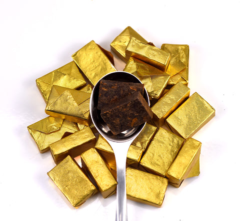 Golden Brick Puerh tea by Lake Missoula Tea Company, showing tightly packed golden-brown tea bricks with textured surface.