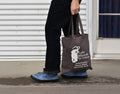 Lake Missoula Tea Company LMTC tote bag featuring a durable canvas design with the brand logo for carrying essentials.