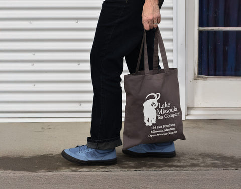 Lake Missoula Tea Company LMTC tote bag featuring a durable canvas design with the brand logo for carrying essentials.