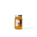 Raw Montana Honey teaware from Lake Missoula Tea Company, featuring a jar of honey and elegant tea accessories.
