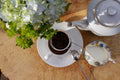 Horizontal image of Lake Missoula Breakfast Tea by Lake Missoula Tea Company, featuring winter blue-themed packaging.