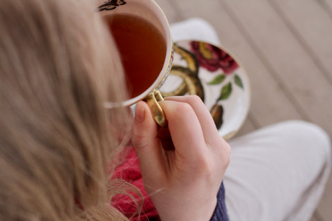 Cup of Sweet Chamomile Black tea from Lake Missoula Tea Company, featuring a steaming black tea with chamomile flowers.