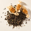 Big Sky Salted Caramel loose leaf tea with three soft caramels in parchment wrappers