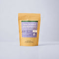 Sun Kissed Huckleberry 2oz bag with colorful label on blue background.