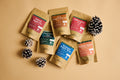Seasonal Lake Missoula Tea Company tea pouches arranged with pinecones