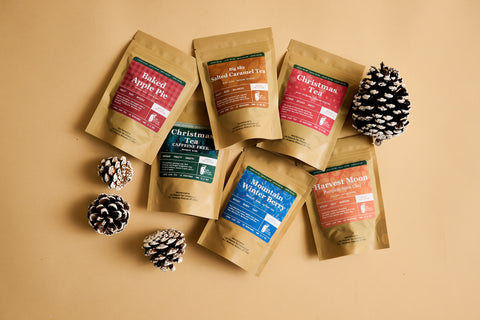 Seasonal Lake Missoula Tea Company tea pouches arranged with pinecones